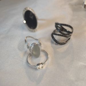 Lot of 4 custom silver tone women's rings various sizes